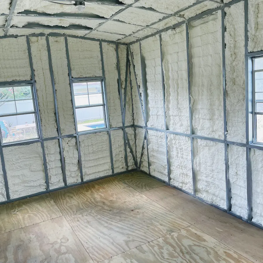 Closed-cell spray foam insulation applied to wall cavities in a residential project in Fort Atkinson